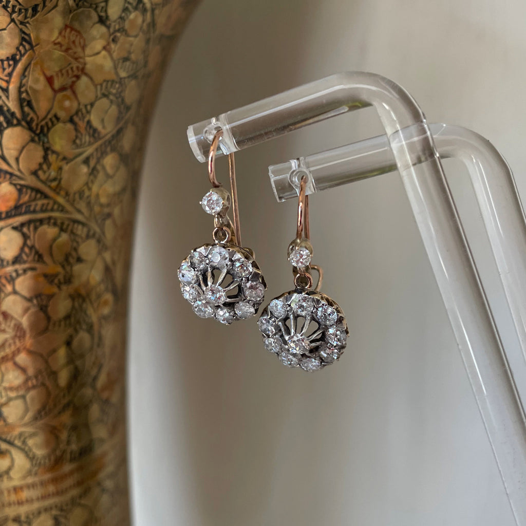 Diamond cluster earrings on posts with case.