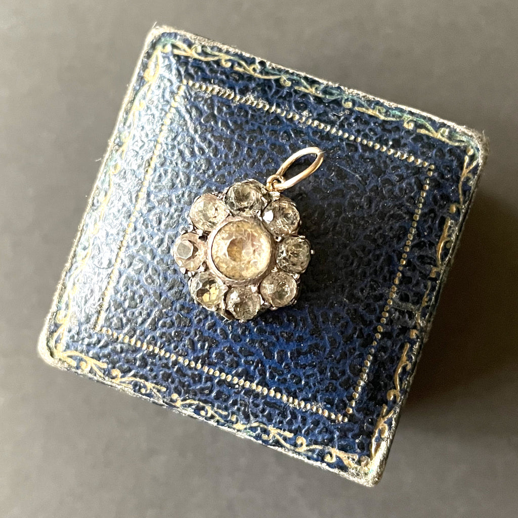 Georgian white paste flower pendant on an antique blue ring box.
