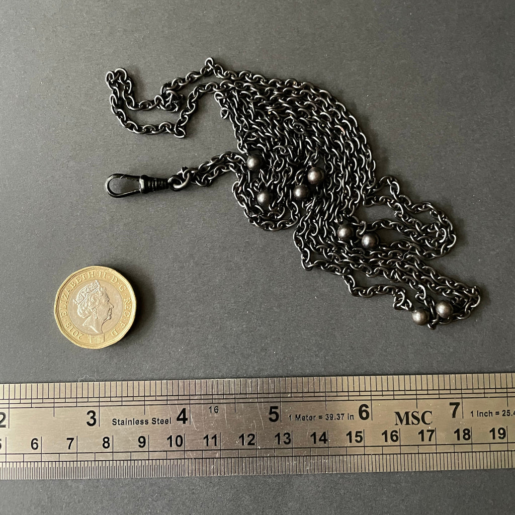 Gunmetal long guard chain with dog clip.