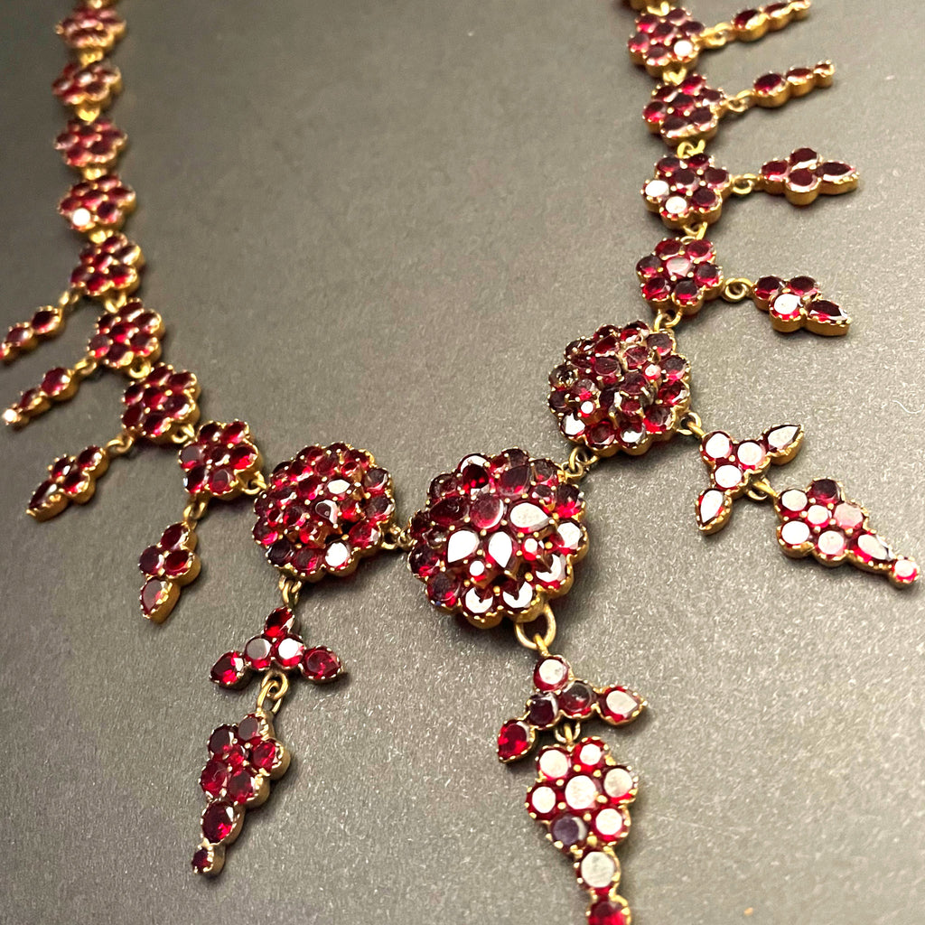garnet drop necklace with floral motif