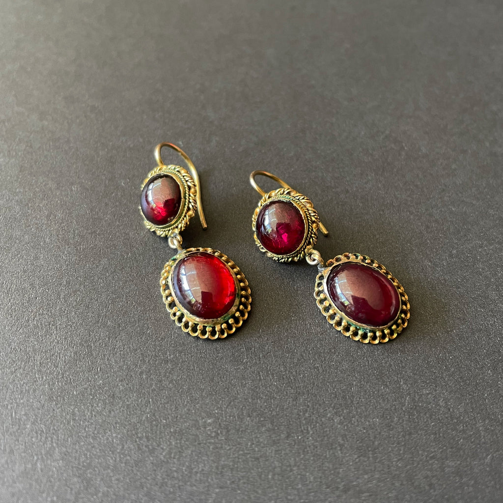GArnet earrings with braided gold work.