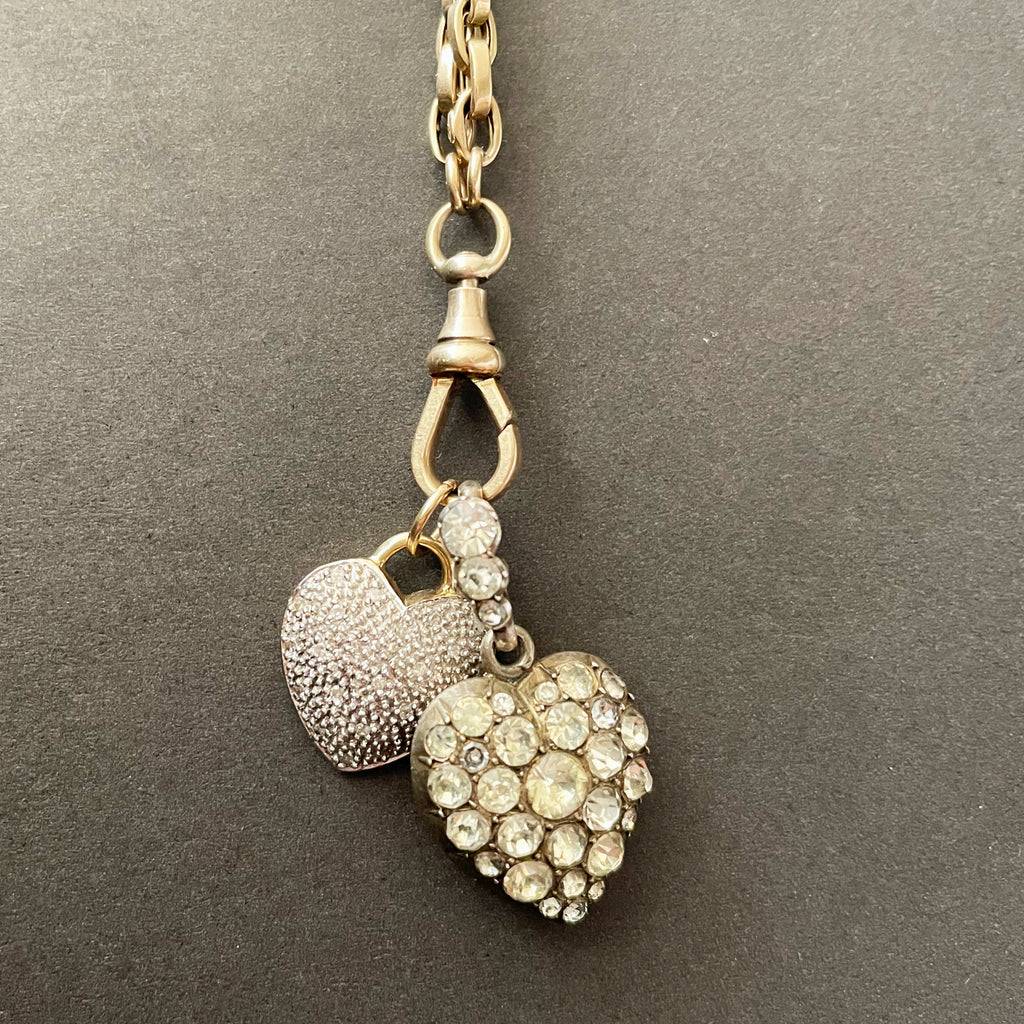 two heart shaped pendants on longguard gold chain