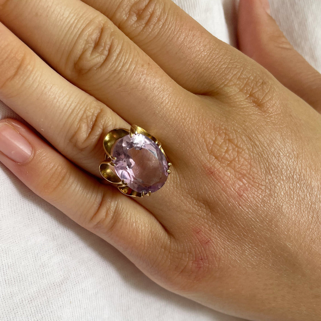 Large amethyst ring with gold scalloped band.