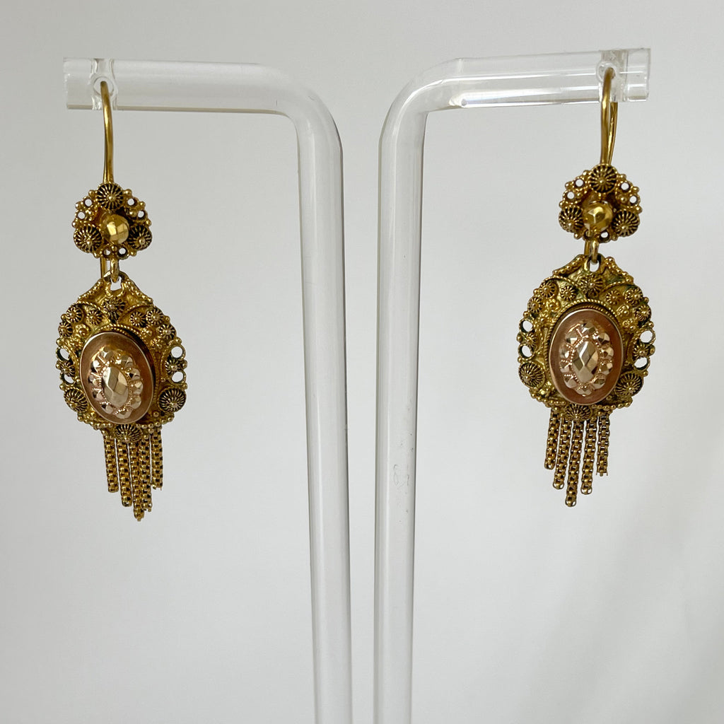 Front of gold earrings.
