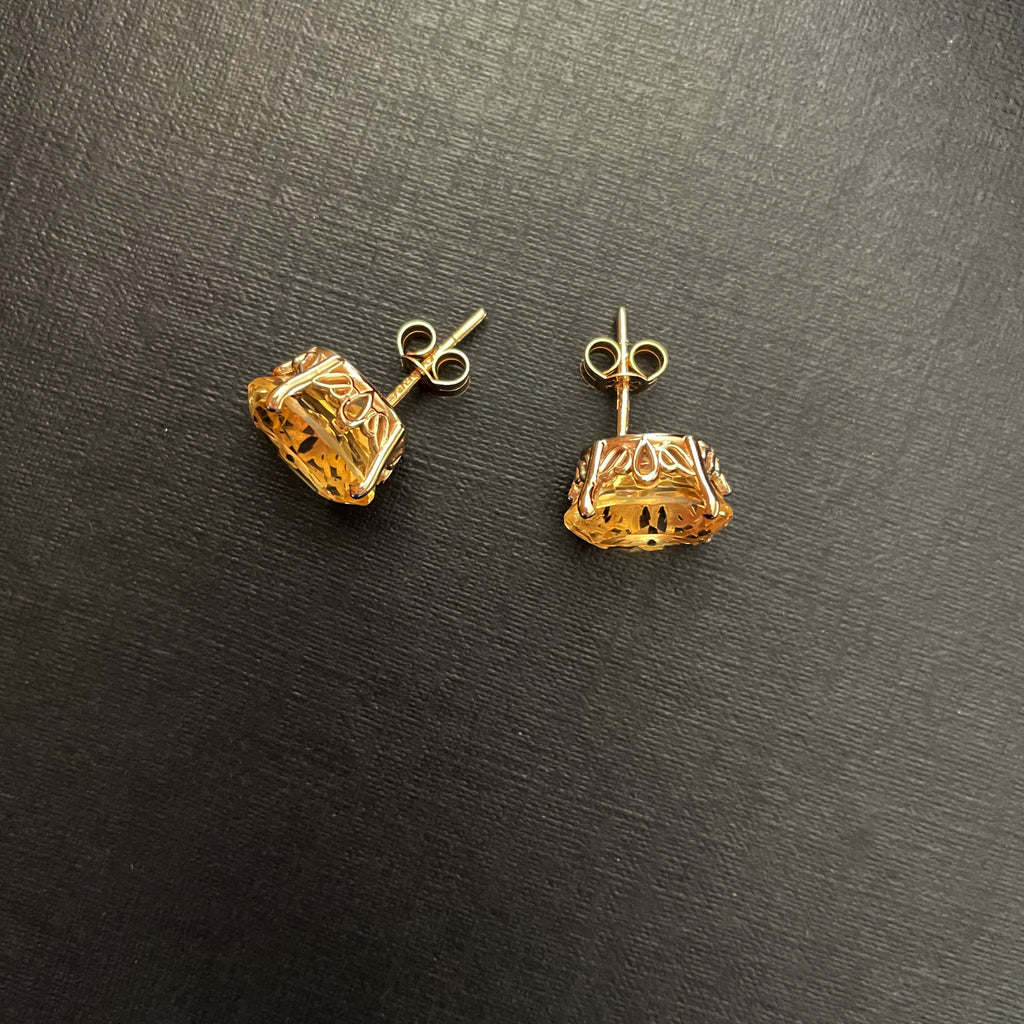 large citrine gemstone stud earrings in gold with scrollwork settings